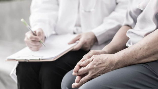Patient Discussing Health With Doctor