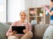 Rittenhouse Village Resident Reading On Tablet