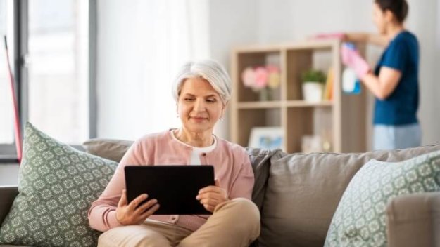 Rittenhouse Village Resident Reading On Tablet