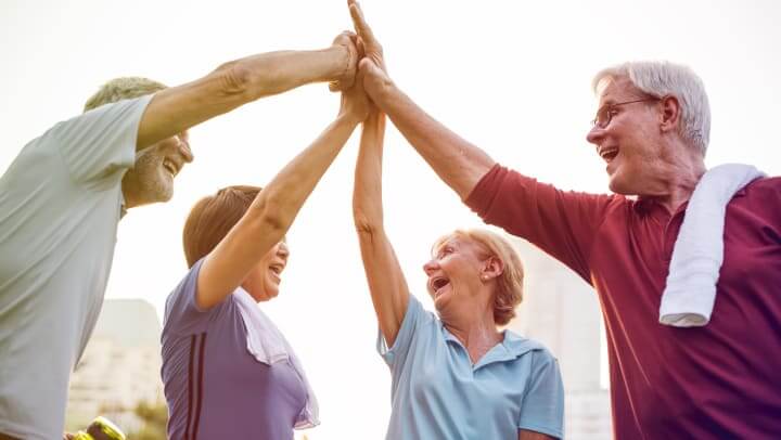 Senior Living Residents Congratulating Each Other