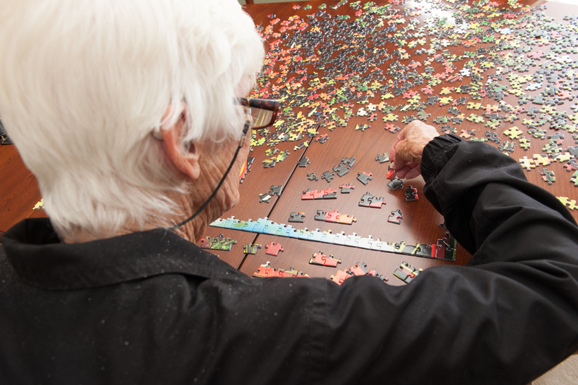 Jigsaw puzzle put together by an eldery woman Cognitive Activities For Seniors