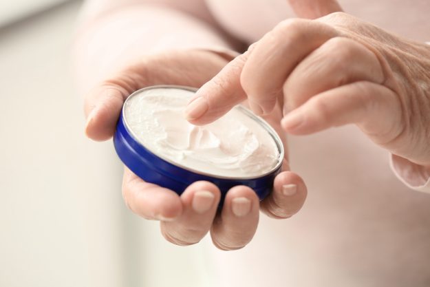 Elderly woman applying cosmetic cream onto her hands at home, cl Tips For Preventing Bed Sores In The Elderly