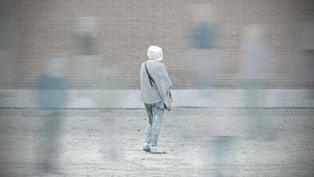 Old woman with dementia among the society