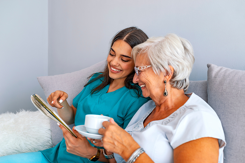 Young caring lovely caregiver and happy ward