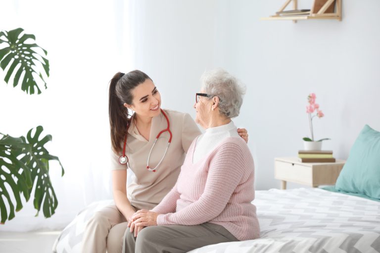 Doctor with senior woman in nursing home Setting Up A Safe Living Environment For Someone With Dementia