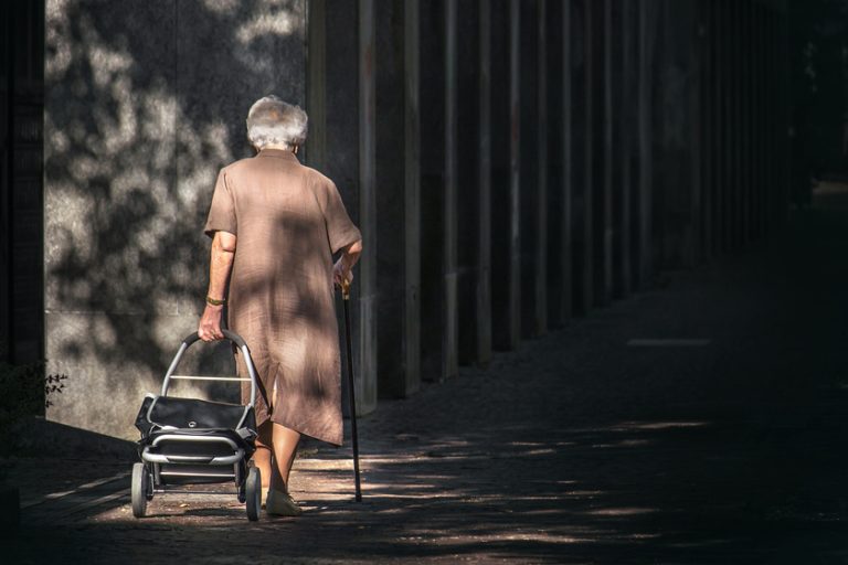 old woman walking alone Top 5 Causes Of Dementia Wandering