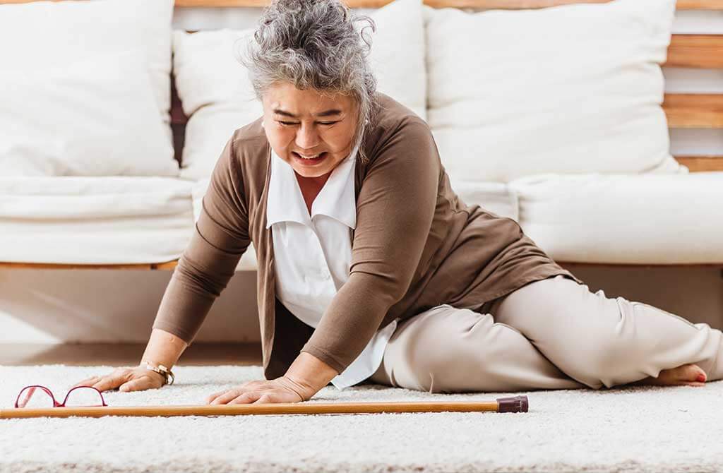 Asian senior woman falling down lying on floor at home alone Asian senior woman falling down lying on floor at home alone