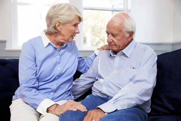 Wife Talking To Depressed Senior Husband At Home Wife Talking To Depressed Senior Husband At Home