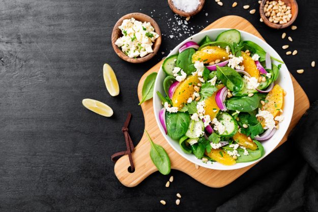 Fresh spinach salad with oranges, feta (ricotta) cheese, red oni X Foods That Promote Healthy Aging