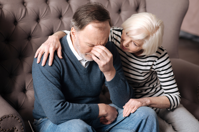 Elderly woman calming down her depressed husband. Elderly woman calming down her depressed husband.
