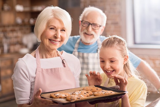 girl looking at homemade cookies girl looking at homemade cookies
