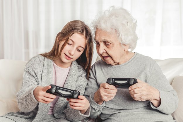 Grandmother with granddaughter playing games