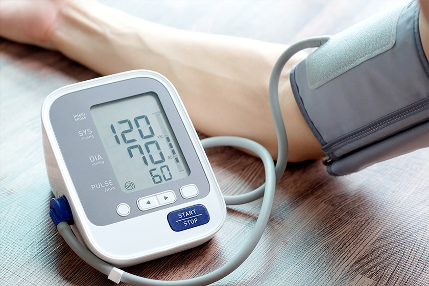 Man check blood pressure monitor and heart rate monitor with digital pressure gauge Man check blood pressure monitor and heart rate monitor with digital pressure gauge
