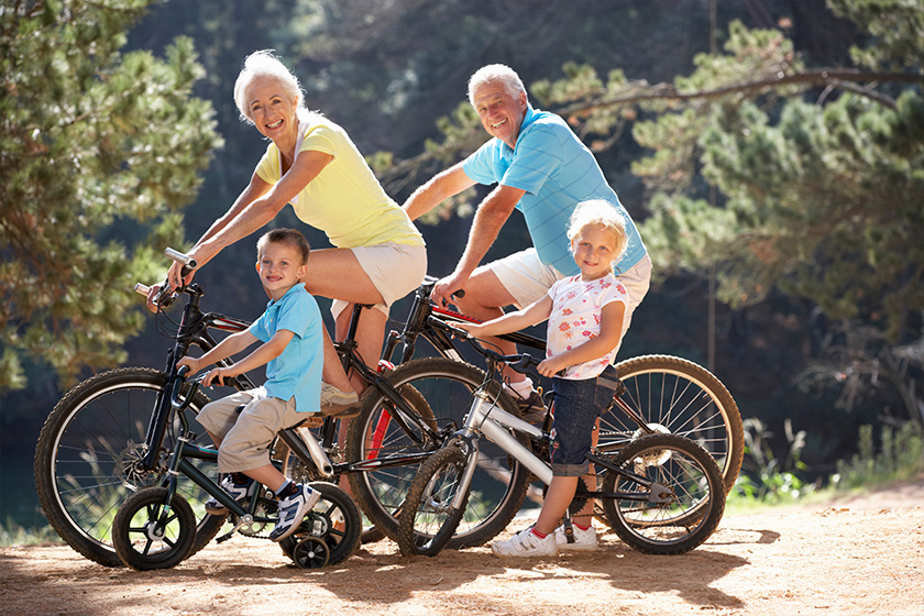 Senior couple with grandchildren on country bike ride Senior couple with grandchildren on country bike ride