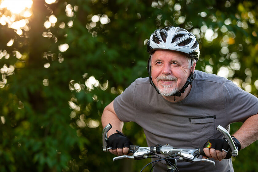 Senior man enjoying lovely bike riding