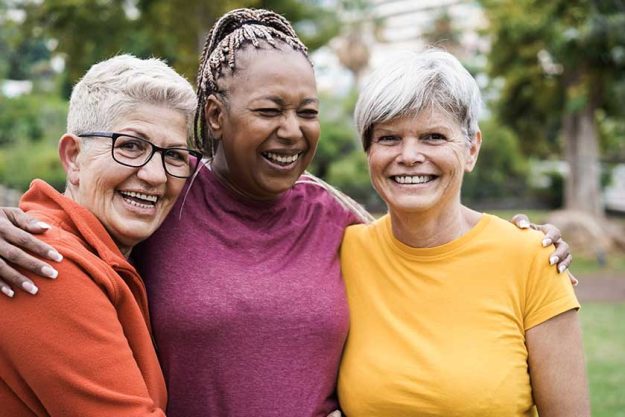 Multiracial senior women having fun together after sport workout outdoor
