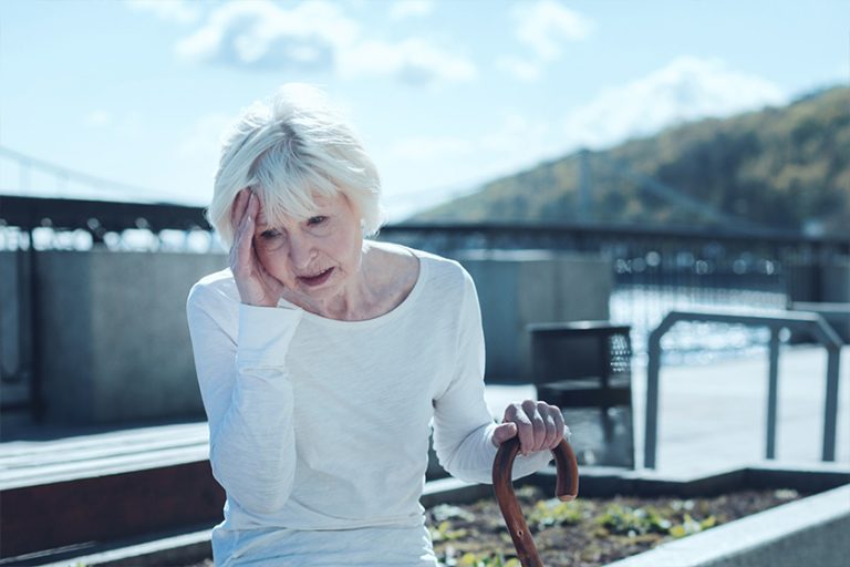 Cannot stand it anymore. Annoyed senior lady in casual attire touching her head Cannot stand it anymore. Annoyed senior lady in casual attire touching her head