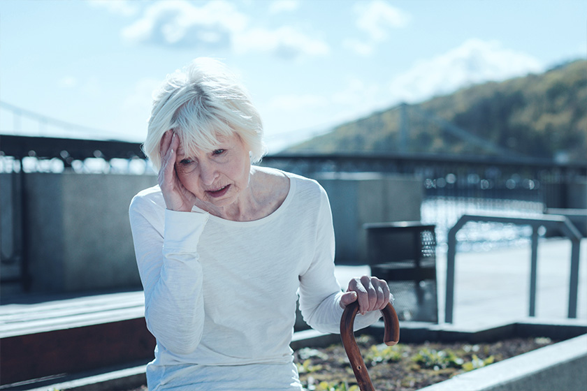 Cannot stand it anymore. Annoyed senior lady in casual attire touching her head Cannot stand it anymore. Annoyed senior lady in casual attire touching her head