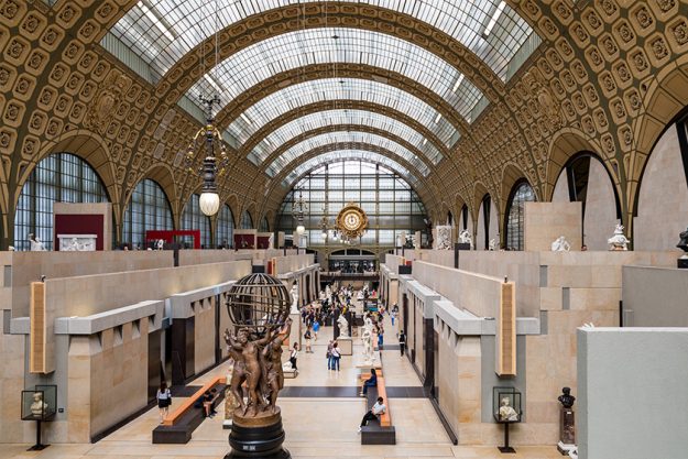 Paris, France – July 5, 2018: Visitors at the Musee d’Orsay in Paris Paris, France - July 5, 2018: Visitors at the Musee d'Orsay in Paris