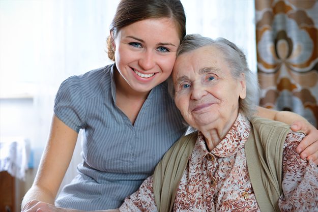 Senior woman with her home caregiver Senior woman with her home caregiver