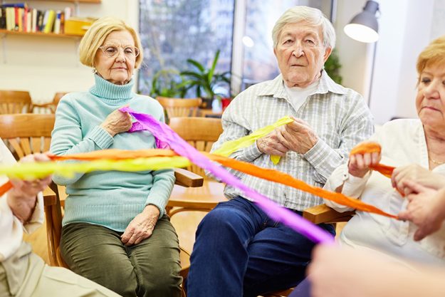 Seniors playing with colored ribbons Seniors playing with colored ribbons