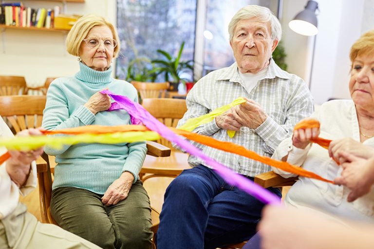 Seniors playing with colored ribbons Seniors playing with colored ribbons