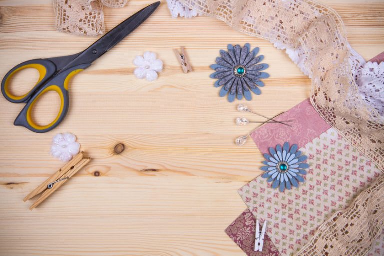 Scrapbooking elements and tools on a wooden table. top view Scrapbooking elements and tools on a wooden table. top view