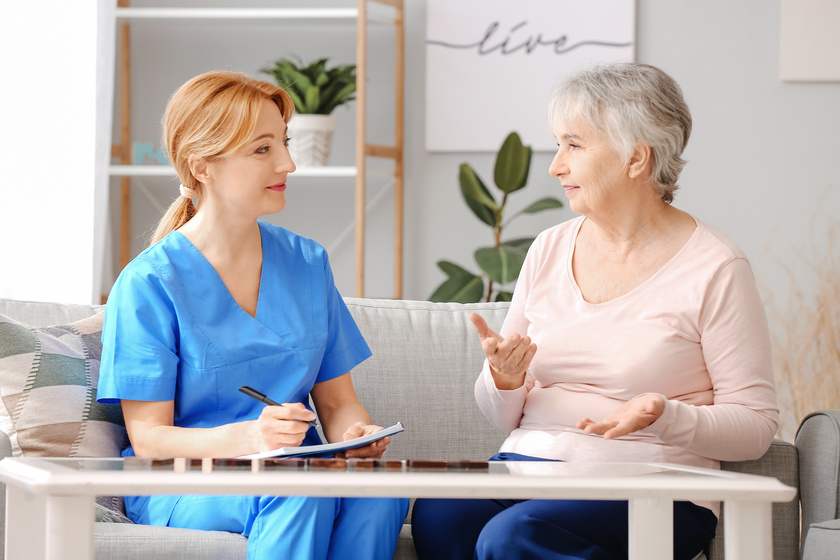 Elderly woman suffering from mental disability and caregiver in SHINE Memory Care Living Program In Griffith IN For Your Loved One With Dementia