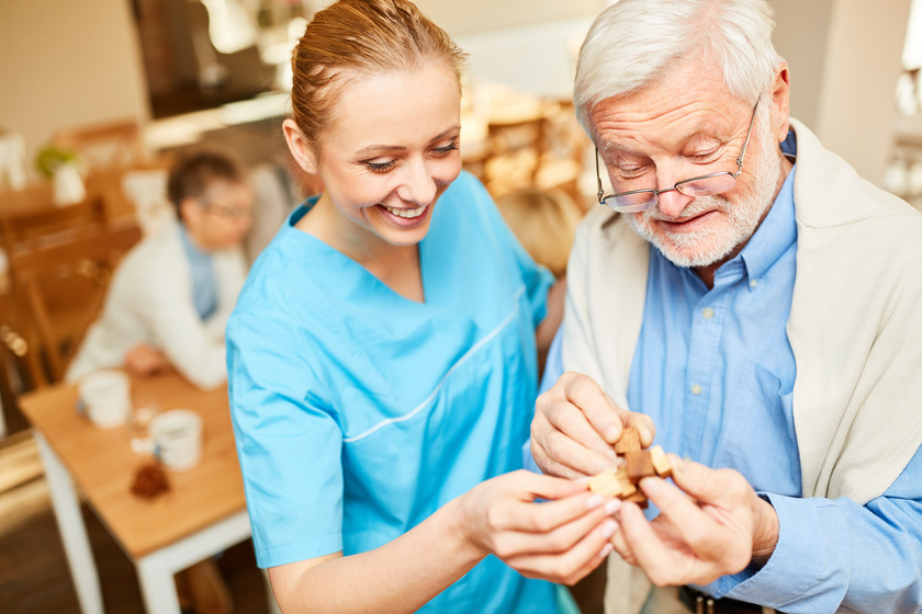 Senior with dementia and a caregiver 4 Tips To Support Your Loved One With Anxiety Caused By Dementia