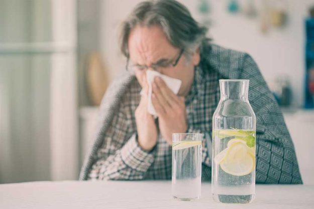 Flu senior man with blanket Flu senior man with blanket