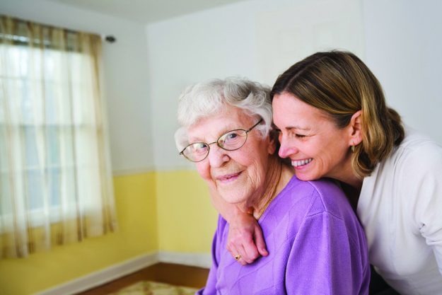 Daughter hugging Elderly mother Daughter hugging Elderly mother
