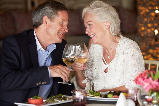 Shot of an affectionate senior couple enjoying a meal together
