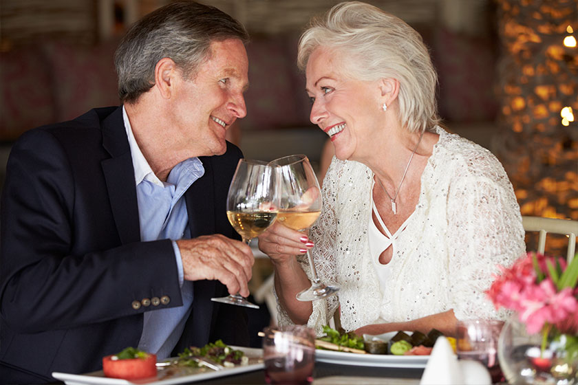 Shot of an affectionate senior couple enjoying a meal together Shot of an affectionate senior couple enjoying a meal together