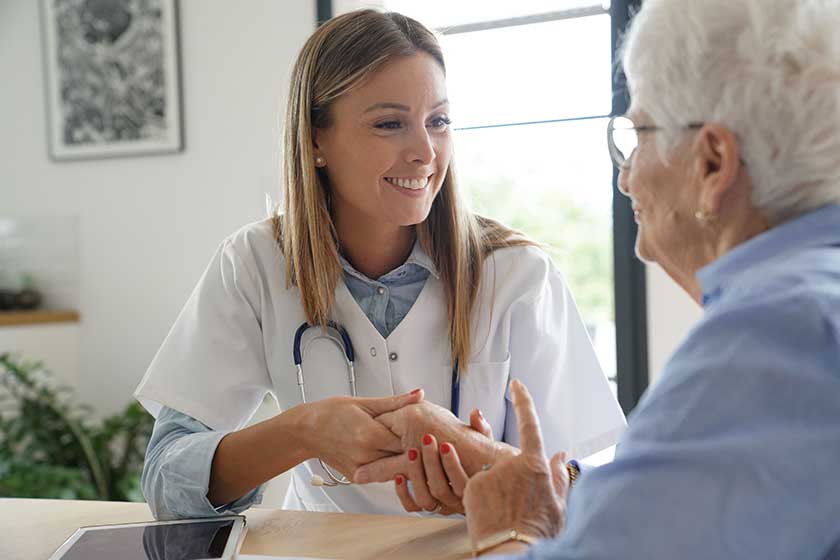 Elderly woman with nurse at home Elderly woman with nurse at home