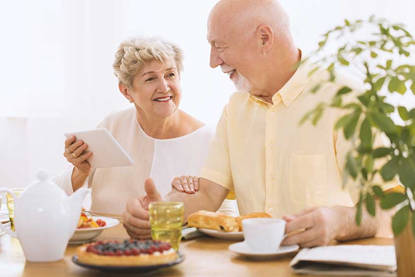 Happy grandmother using tablet