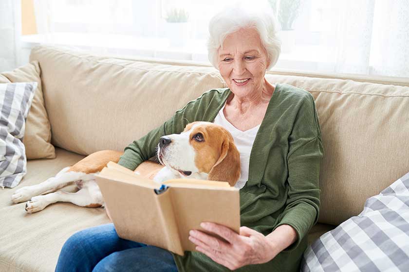 Portrait of happy senior woman enjoying leisure time at home