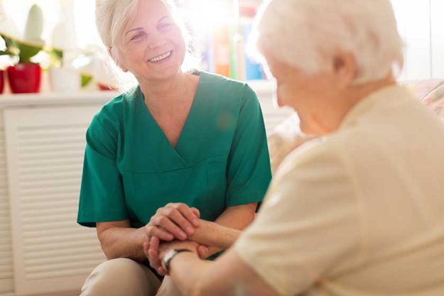 Senior woman with her female caregiver