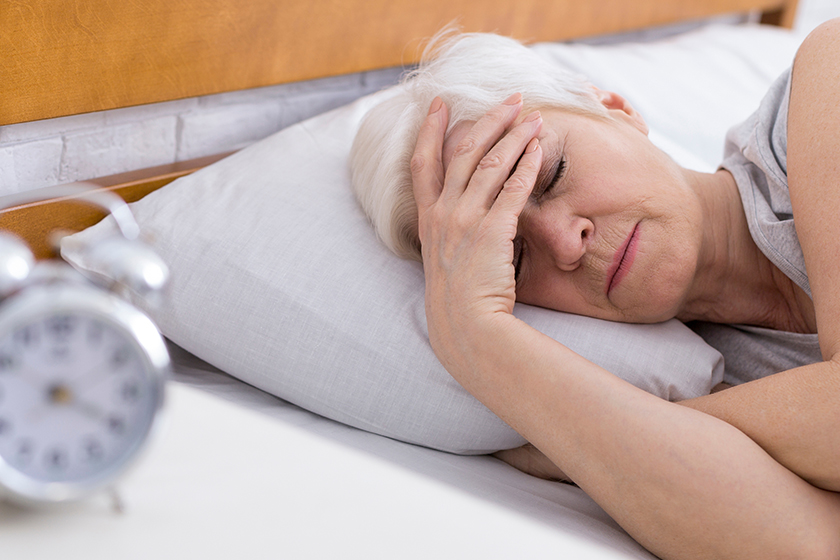 SEnior woman suffering from insomnia in bed SEnior woman suffering from insomnia in bed