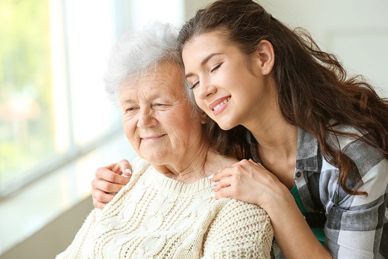 Senior woman with her granddaughter in nursing home