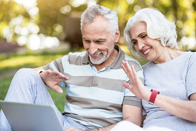 Elderly family using internet for communication sitting Elderly family using internet for communication sitting