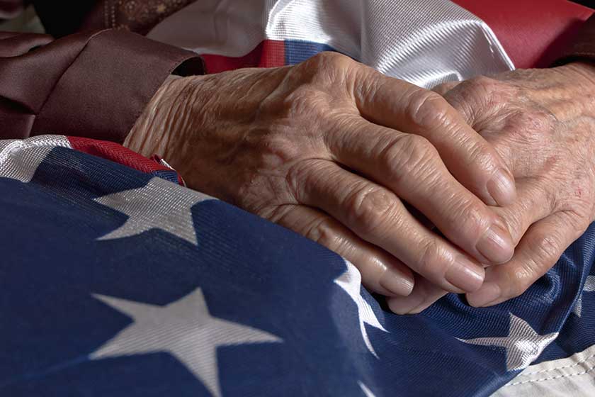 Hands holding an American flag Hands holding an American flag