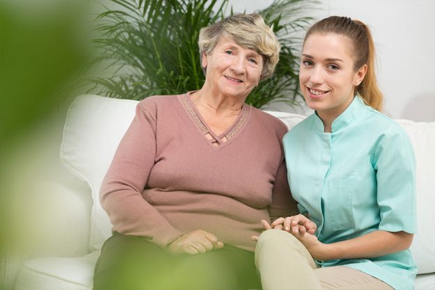 Old female with professional caregiver Old female with professional caregiver
