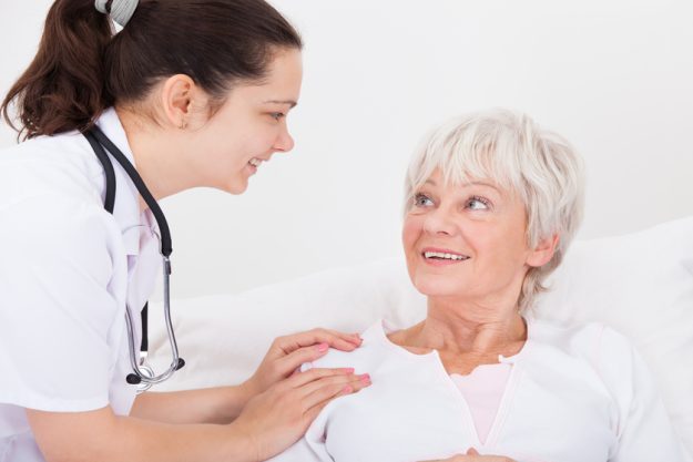 Happy Doctor And Patient Looking At Each Other Doctor And Patient