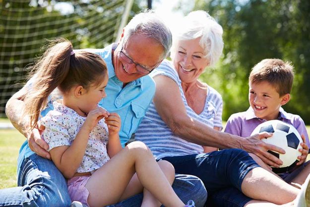 Grandparents And Grandchildren Playing Football Grandparents And Grandchildren Playing Football