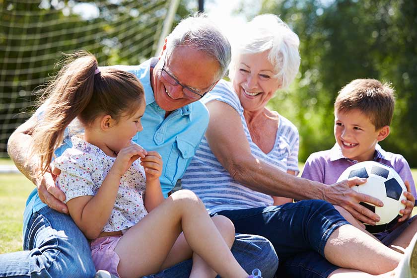 Grandparents And Grandchildren Playing Football Grandparents And Grandchildren Playing Football