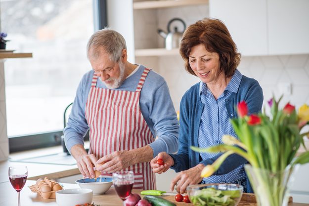 A portrait of senior couple in love indoors at home