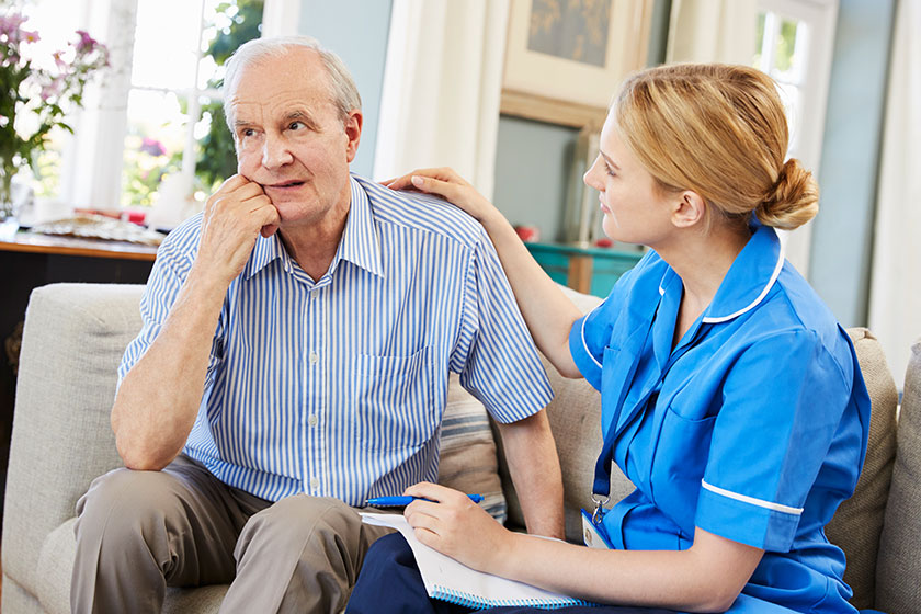 Community Nurse Visits Senior Man