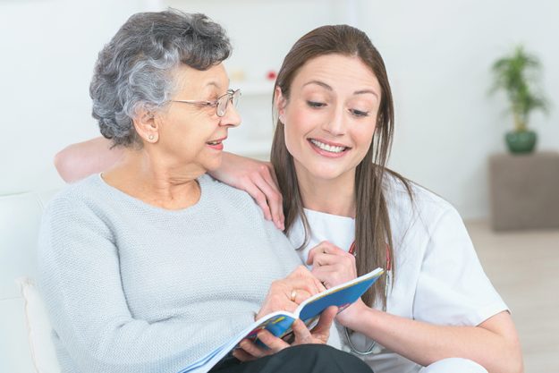 Helping old lady to read Helping old lady to read
