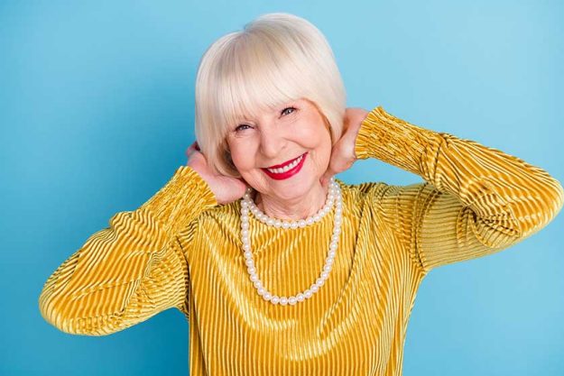 Photo of positive short hairdo elder lady