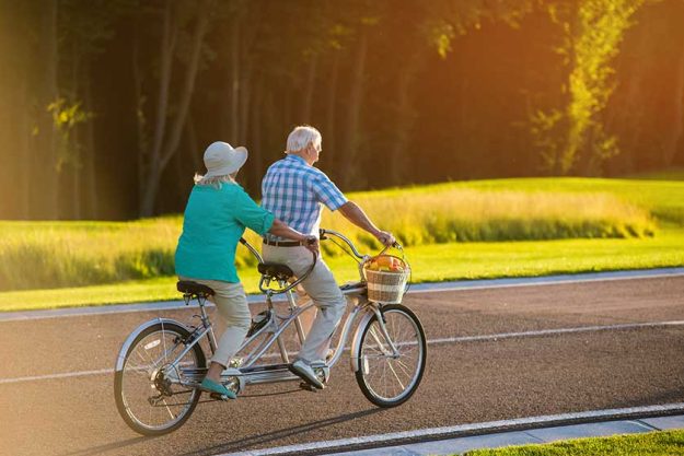 Senior couple on tandem bicycle